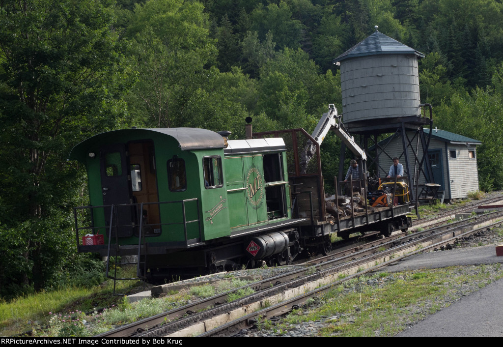 MWCR M1 comes off the mountain with a maintenance of way work train in advance of the first passenger train departure for the summit